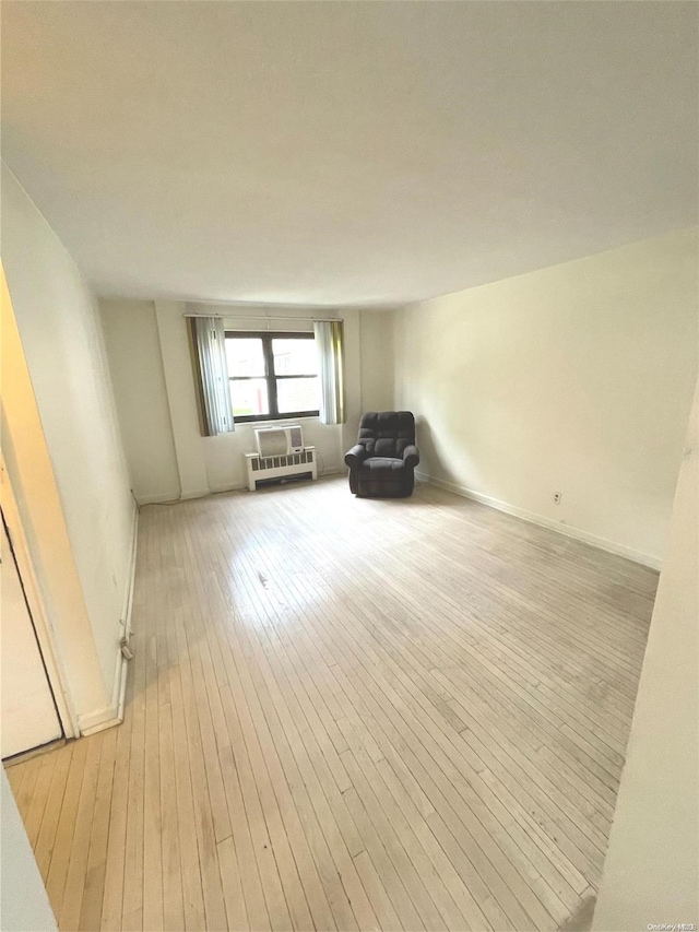 unfurnished room with light wood-type flooring