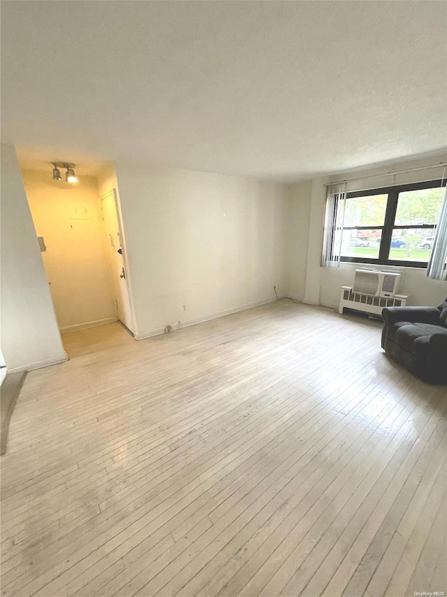 unfurnished living room with light wood-type flooring