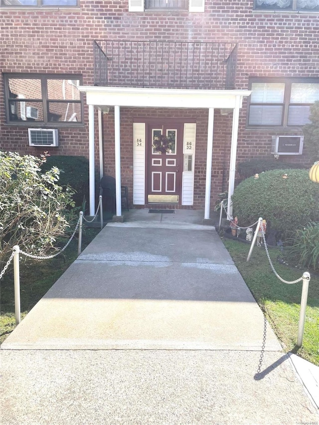 view of exterior entry with covered porch