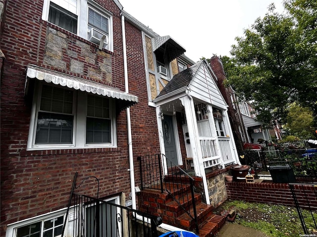 view of front of home featuring brick siding