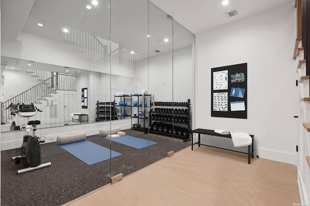 gym featuring a high ceiling