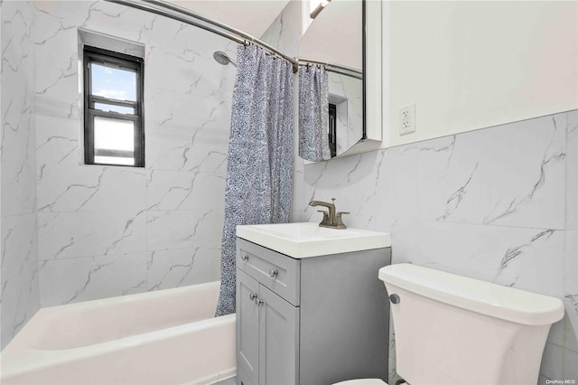 full bathroom with vanity, toilet, tile walls, and shower / tub combo with curtain