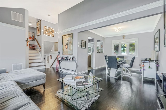 living room featuring crown molding, dark wood-type flooring, and a chandelier