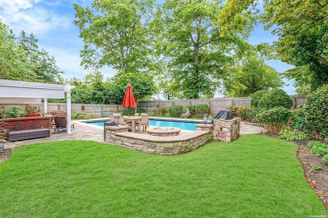 view of yard with a fenced in pool and a patio