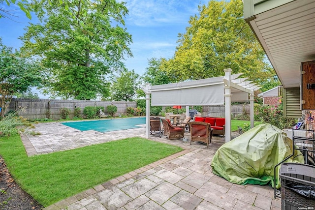 view of swimming pool featuring a patio area, an outdoor living space, a yard, and grilling area