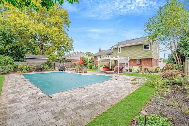 view of pool with a patio area and a pergola