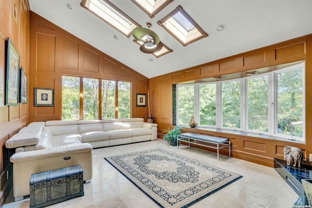 sunroom / solarium with lofted ceiling with skylight and a wealth of natural light