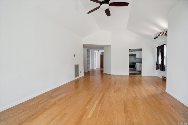 unfurnished living room with ceiling fan, light hardwood / wood-style floors, and vaulted ceiling