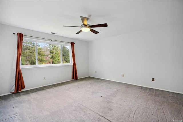 empty room with carpet floors and ceiling fan