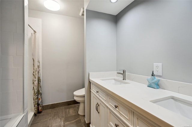 bathroom with vanity, a shower with shower curtain, and toilet