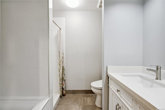 bathroom featuring vanity, toilet, and walk in shower