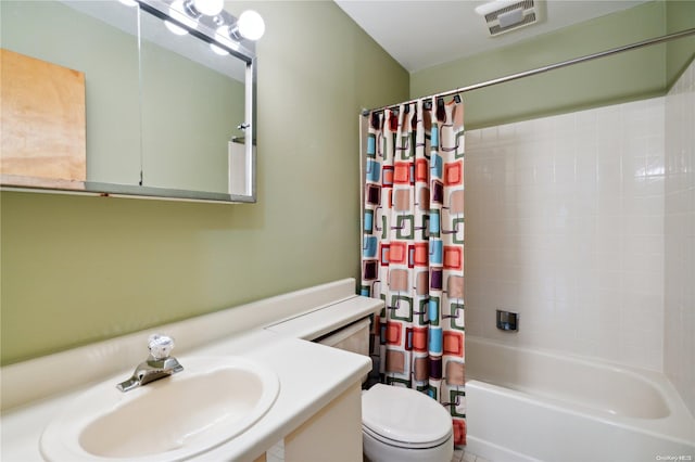 full bathroom featuring shower / bath combo, toilet, and sink