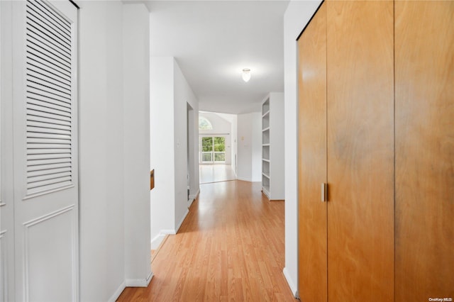 hall with light wood-type flooring