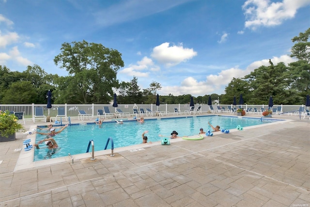 view of swimming pool with a patio area