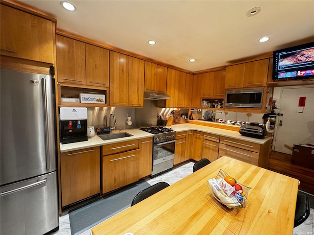 kitchen with sink and appliances with stainless steel finishes