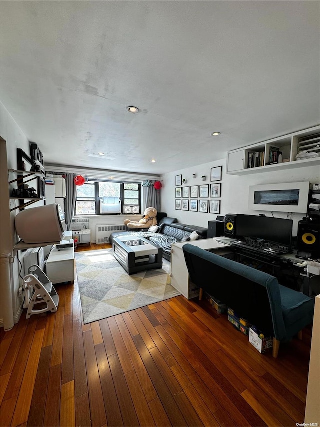 living room featuring hardwood / wood-style floors and radiator heating unit