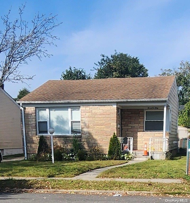 view of front of home with a front yard