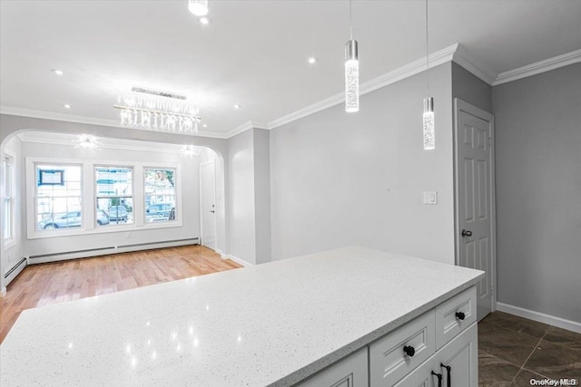 kitchen featuring baseboard heating, dark wood-type flooring, crown molding, white cabinetry, and hanging light fixtures