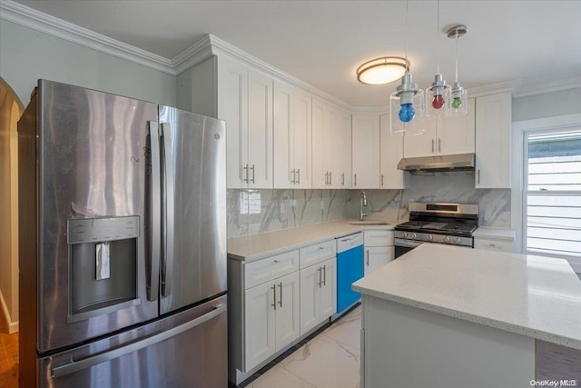 kitchen with a center island, white cabinets, sink, hanging light fixtures, and stainless steel appliances