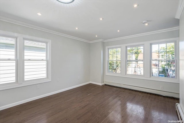 spare room featuring baseboard heating, dark wood-type flooring, and ornamental molding