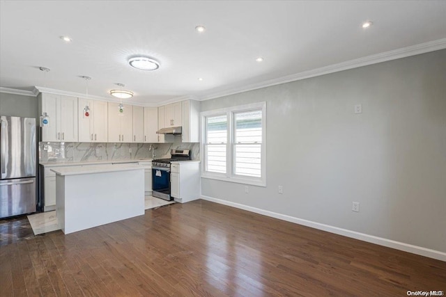 kitchen with white cabinetry, a kitchen island, dark hardwood / wood-style floors, and appliances with stainless steel finishes