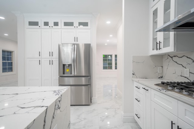 12 Hoover Ln, Bethpage, NY 11714 - kitchen with appliances with stainless steel finishes, light marble finish flooring, range hood, light stone countertops, and white cabinets