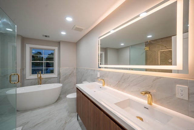 12 Hoover Ln, Bethpage, NY 11714 - full bath with a freestanding bath, double vanity, a shower stall, tile walls, and wainscoting