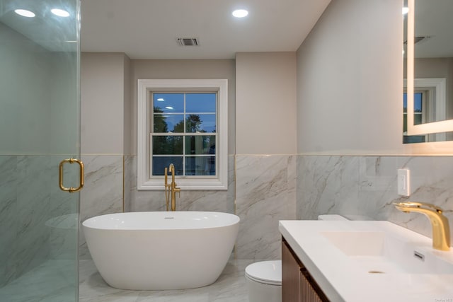 12 Hoover Ln, Bethpage, NY 11714 - bathroom featuring a freestanding tub, vanity, marble finish floors, a marble finish shower, and tile walls