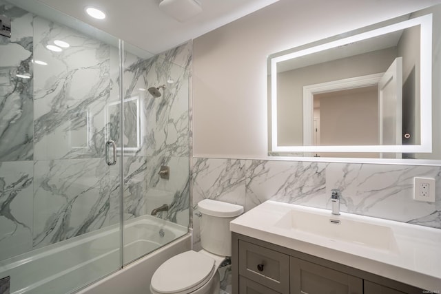 12 Hoover Ln, Bethpage, NY 11714 - full bathroom with shower / bath combination with glass door, vanity, tile walls, a wainscoted wall, and recessed lighting
