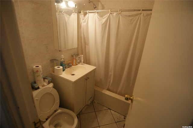 full bathroom featuring tile patterned floors, vanity, shower / bathtub combination with curtain, and toilet