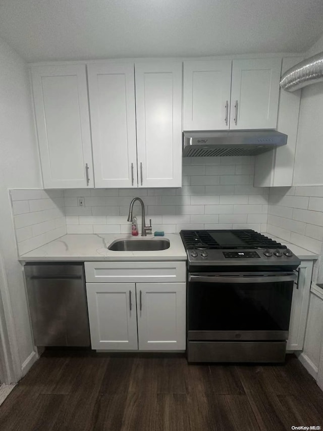 kitchen with gas range, white cabinetry, and dishwasher