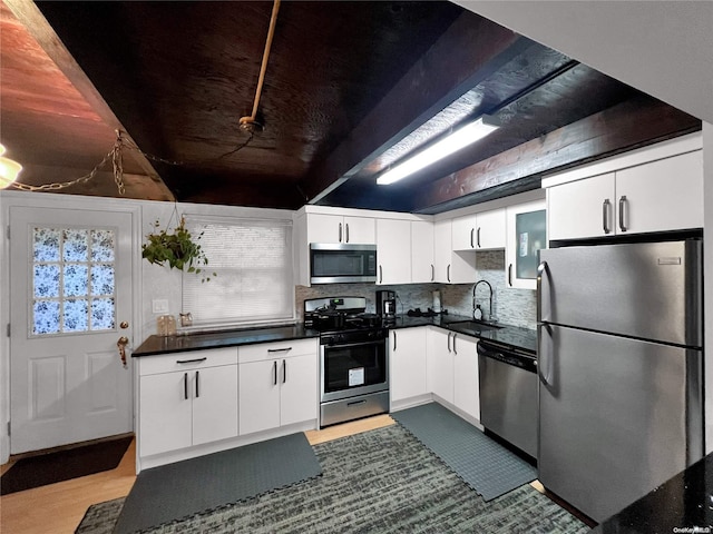 kitchen featuring sink, white cabinetry, and stainless steel appliances