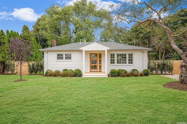 single story home with a front lawn