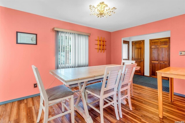 21 Fern Ter, West Babylon, NY 11704 - dining room with light wood-type flooring and baseboards
