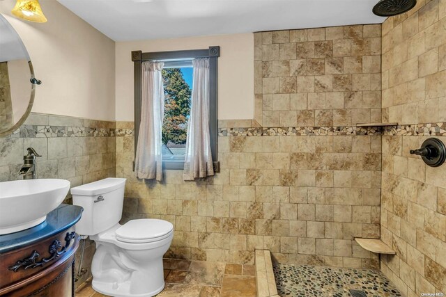 21 Fern Ter, West Babylon, NY 11704 - full bath featuring tile walls, tiled shower, vanity, and wainscoting