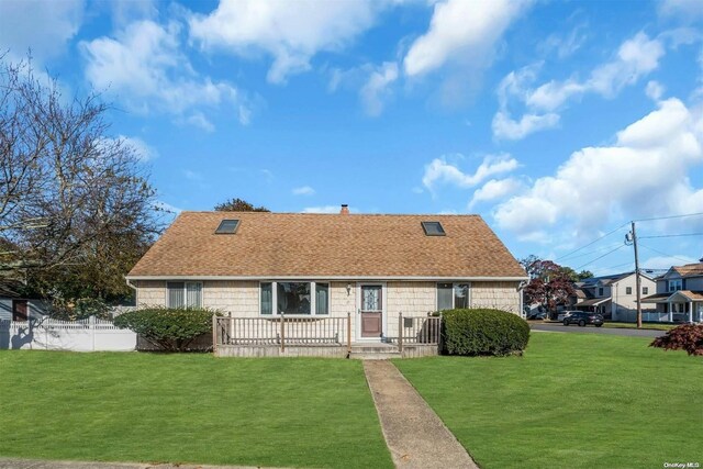 21 Fern Ter, West Babylon, NY 11704 - cape cod-style house featuring a shingled roof and a chimney