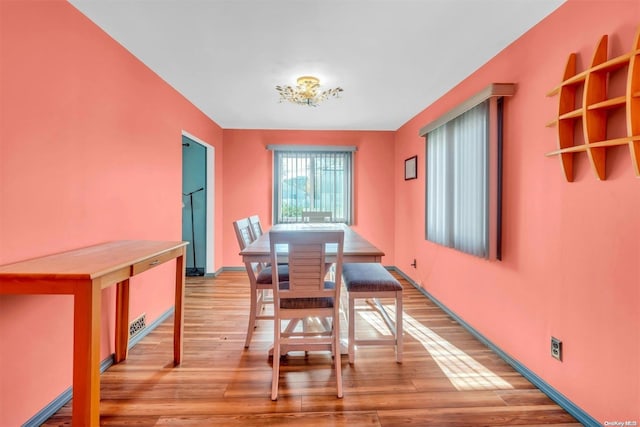 dining space featuring light hardwood / wood-style floors