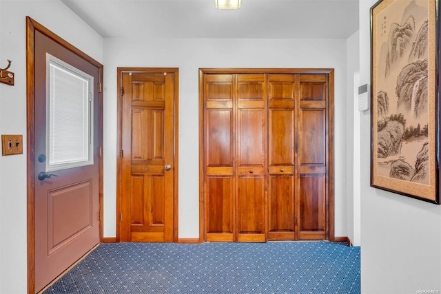 21 Fern Ter, West Babylon, NY 11704 - foyer entrance featuring carpet floors and baseboards