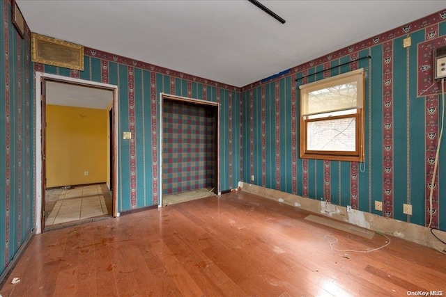 empty room with wood-type flooring