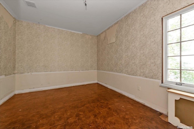 spare room featuring radiator heating unit