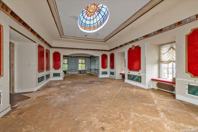 unfurnished living room with ornamental molding