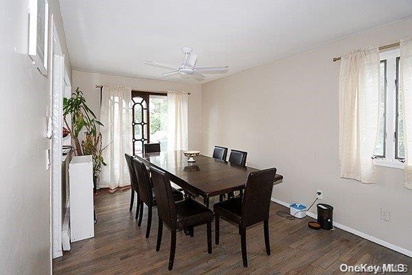 dining area with dark hardwood / wood-style floors and ceiling fan