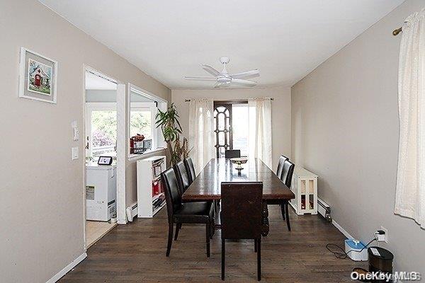 dining room with washer / dryer, dark hardwood / wood-style floors, and ceiling fan