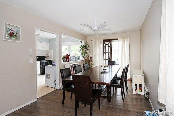 dining area featuring dark hardwood / wood-style flooring and ceiling fan