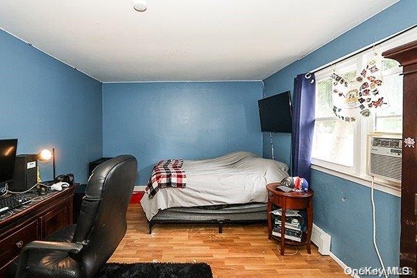 bedroom featuring light wood-type flooring