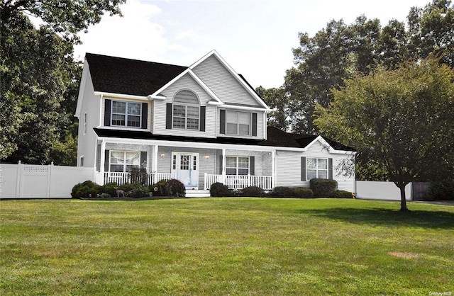 view of front of property with a porch and a front yard