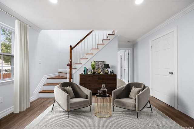 sitting room featuring crown molding and hardwood / wood-style flooring