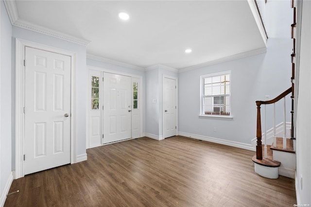 foyer entrance with dark hardwood / wood-style floors and ornamental molding