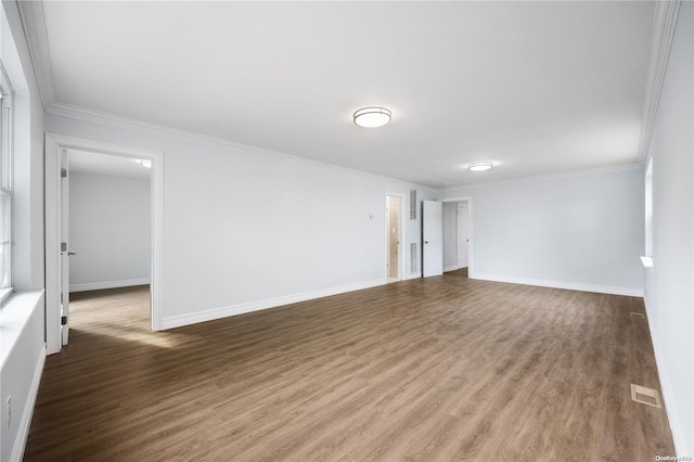 unfurnished room with hardwood / wood-style flooring and crown molding