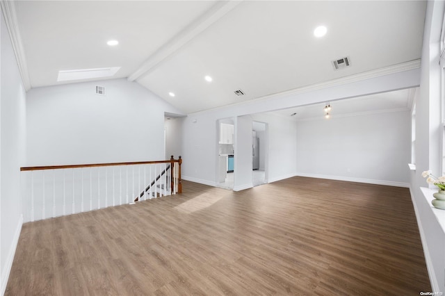 unfurnished living room with vaulted ceiling with beams, hardwood / wood-style floors, and ornamental molding